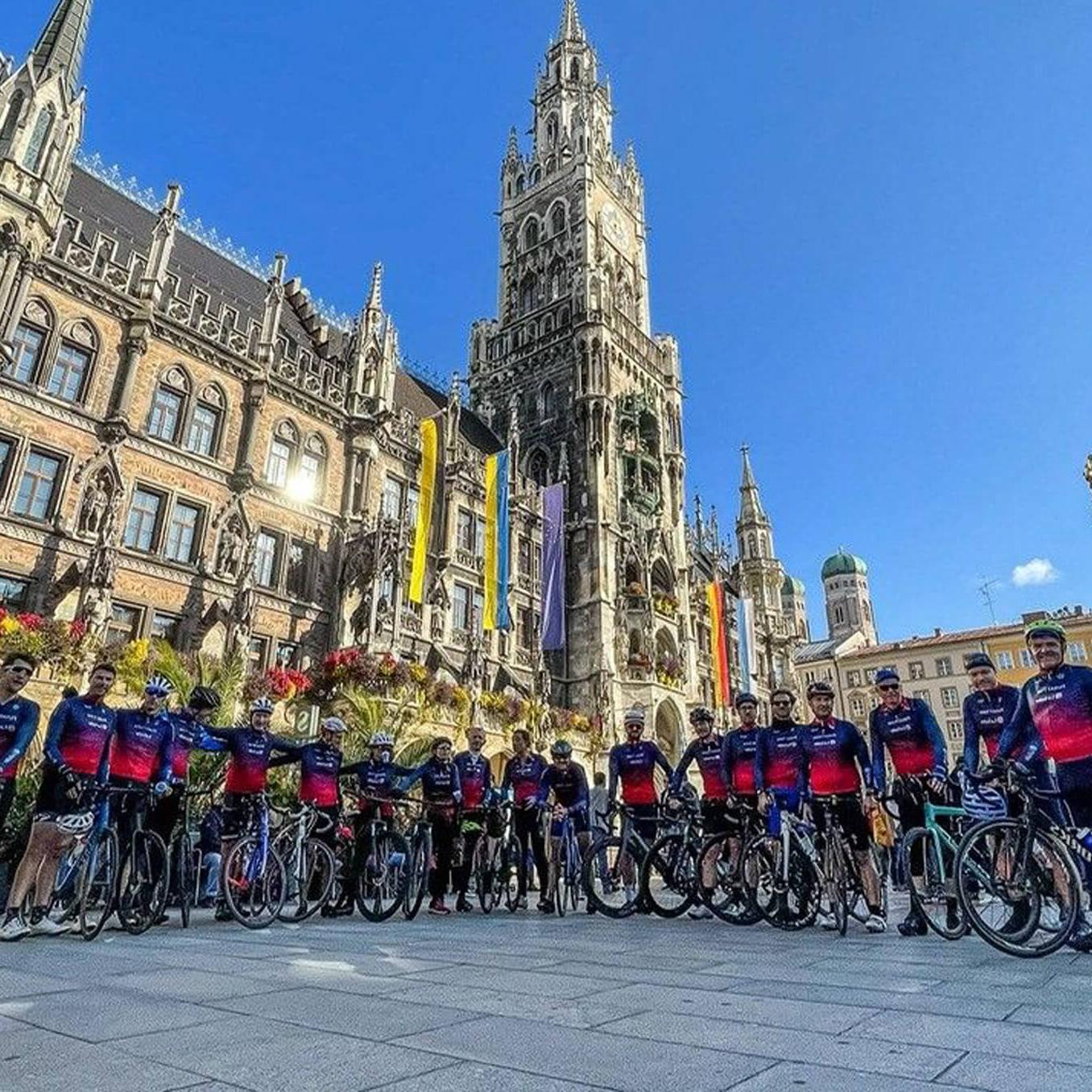 People on the bikes in front of the building